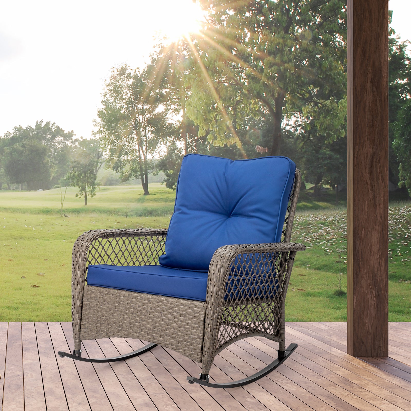 Rattan rocking chair with sparse backrest, grey rattan and blue cushion